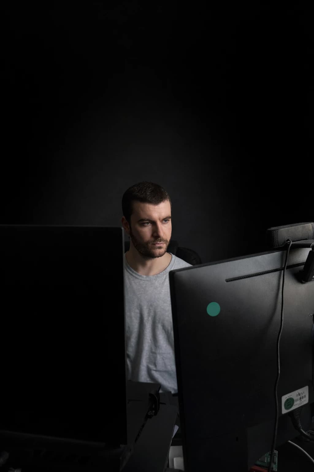 Infrastructure lab workstation portrait behind the monitors